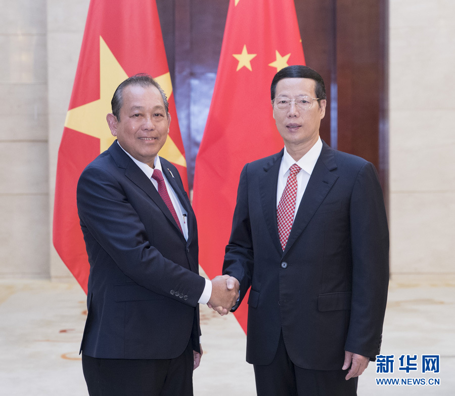  9月11日，中共中央政治局常委、國務院副總理張高麗在廣西南寧會見前來出席第十四屆中國－東盟博覽會和中國－東盟商務與投資峰會的越南常務副總理張和平。新華社記者王曄攝