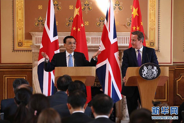     6月17日，國務(wù)院總理李克強(qiáng)同英國首相卡梅倫在倫敦舉行中英總理年度會(huì)晤后共同會(huì)見記者。 新華社記者 龐興雷 攝 